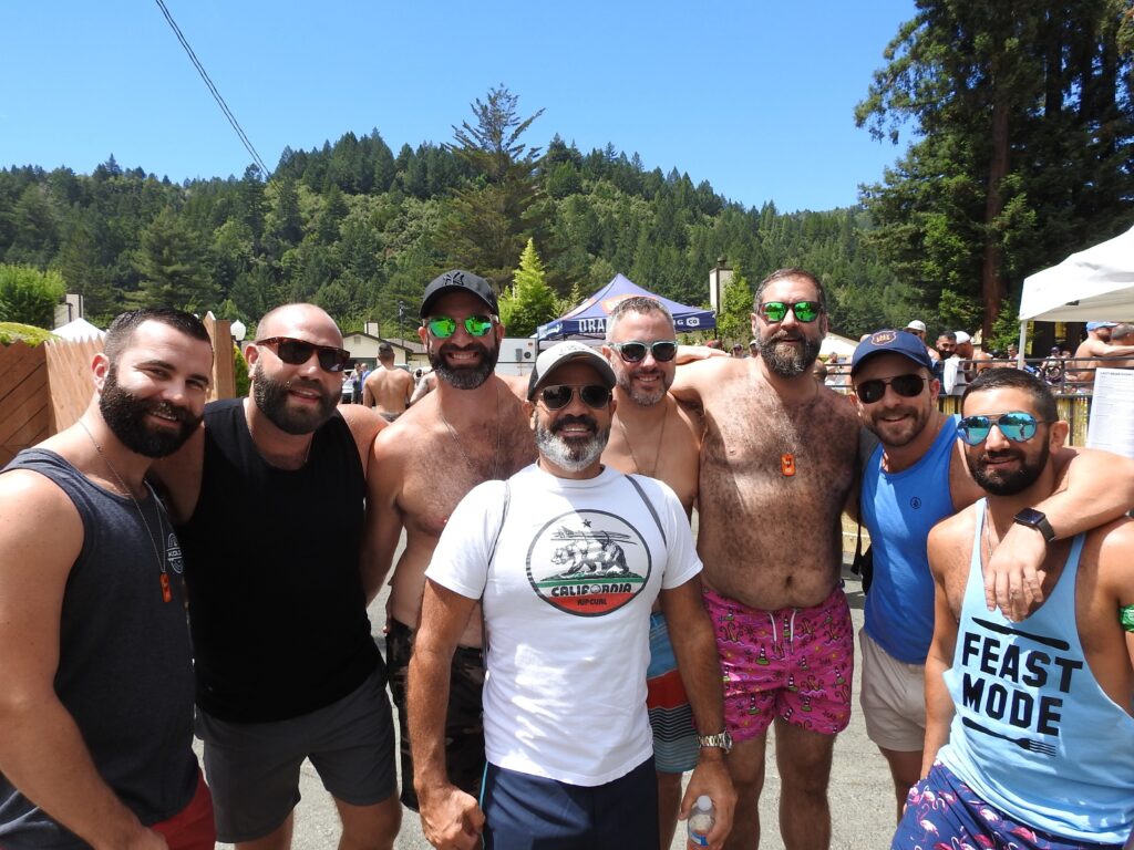 Crowds gathering at a Lazy Bear Week pool party in Guerneville